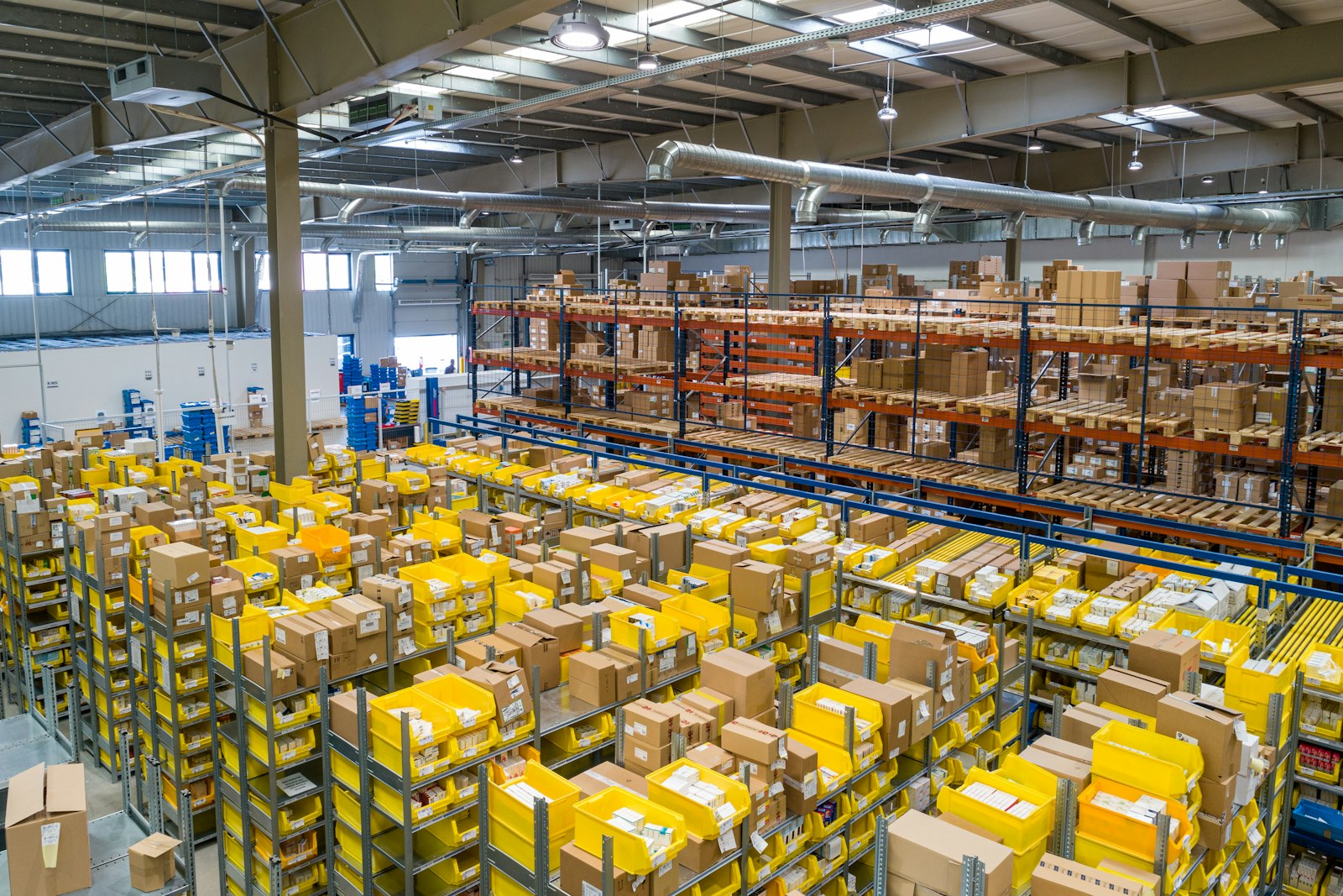 Interior of a modern logistics centre with organised shelving and goods prepared for dispatch